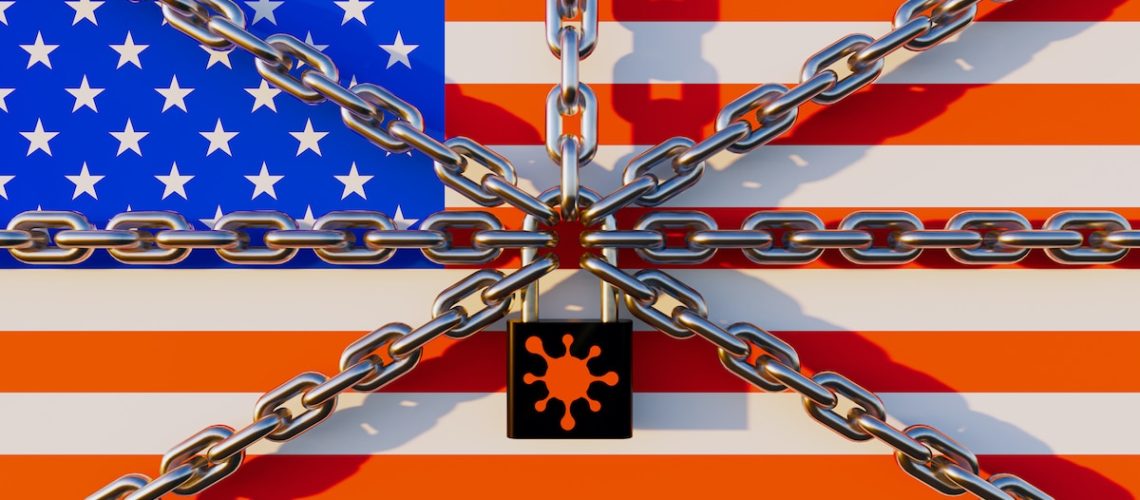 US lockdown concept. Including with US flag, chain, Key lock and coronavirus. Lockdown were issued in the COVID-19 pandemic. Resulted in an economic crisis i.e. travel, transport, food and shopping.