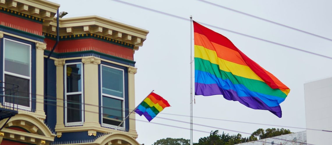 Gay Pride Movement flag on a street of San Francisco, California, USA